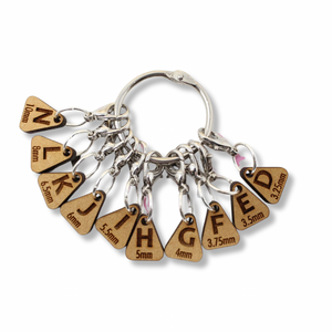 Stitch Markers:  "Crochet Hook Letter Reminder Marker Set" by A Needle Runs Through It